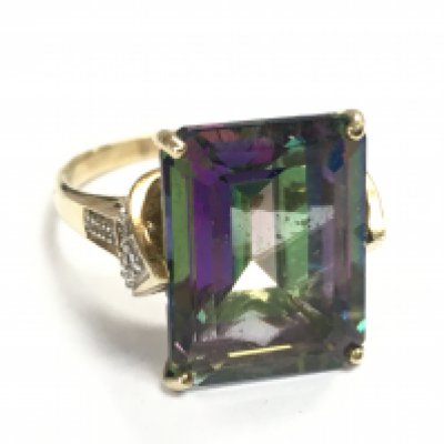 A 9 carat gold emerald and topaz ring , size P, 6g total weight. Postage category A