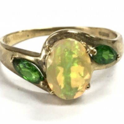 A 9 carat gold Australian Black Opal and emerald ring , size Q. 2.5g total weight Postage category A