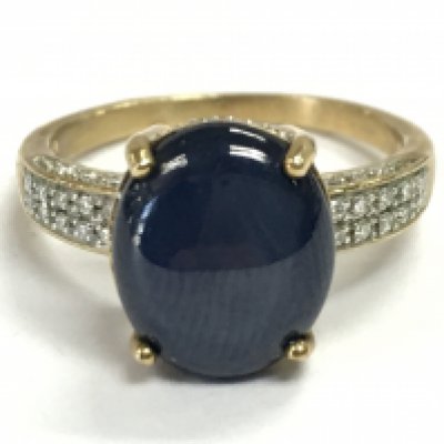 A 9 carat gold Cabochon ring set with diamond shards , size P. 4.2g total weight Postage category A