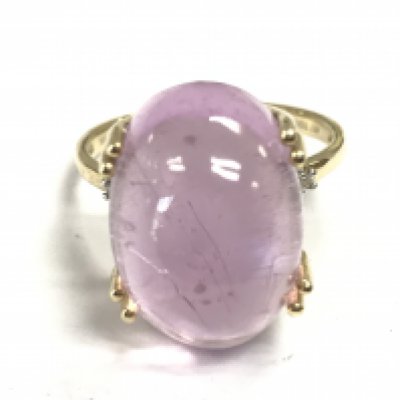 A pink stone 9ct gold ring, size R. 6.9g Postage category A