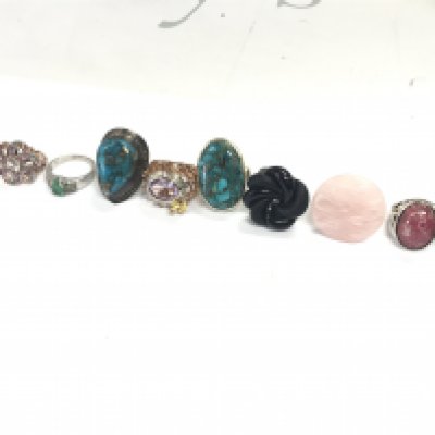 A Collection of silver and costume rings . Postage category A