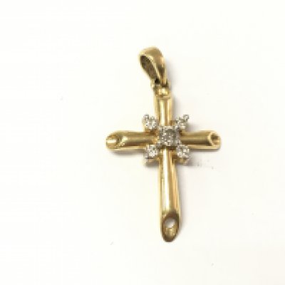 An 18ct gold diamond set cross pendant. 3.52g