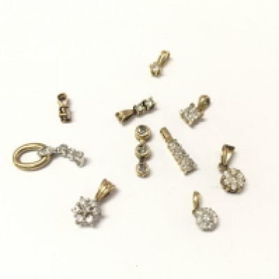 Collective lot of 9ct gold diamond pendants. 7.64g