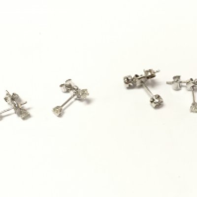 Four pairs of 18ct white gold diamond stud earrings. 3.18g