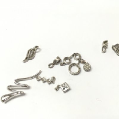 A collection of 9ct white gold diamond pendants. 9.89g