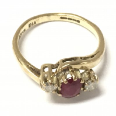 A 9ct gold ruby and diamond ring. Size I and 1.75g