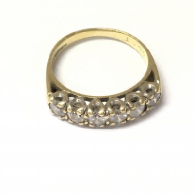 An 18ct gold six diamond set ring. Size M 1/2 and 3.88g Postage A