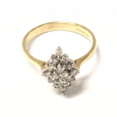 An 18ct gold diamond cluster ring. Size O and 3.74g Postage A