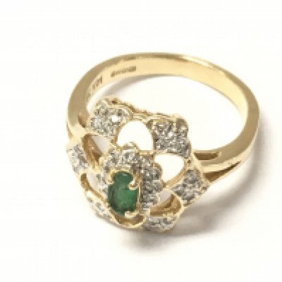 A 14ct gold emerald and diamond set cluster ring. Size L and 3.75g
