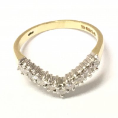An 18ct gold diamond set wishbone ring. Size N and 3.17g Postage A