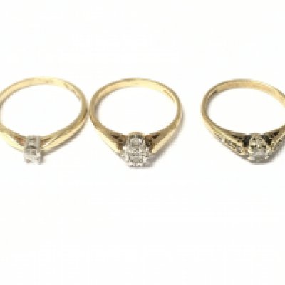 Three 9ct gold diamond solitaire rings. 5.54g total.