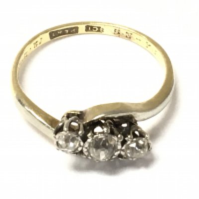 An 18ct gold three old cut diamond ring. Size J and 2.03g