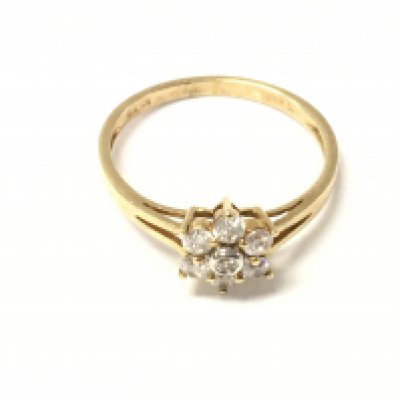 A 14ct gold diamond cluster ring. Size P 1/2 and 2.11g