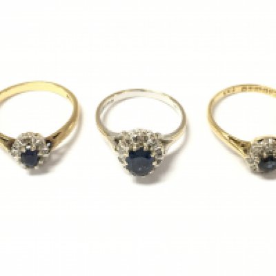 Three 18ct gold sapphire and diamond cluster rings. 8.5g Postage A