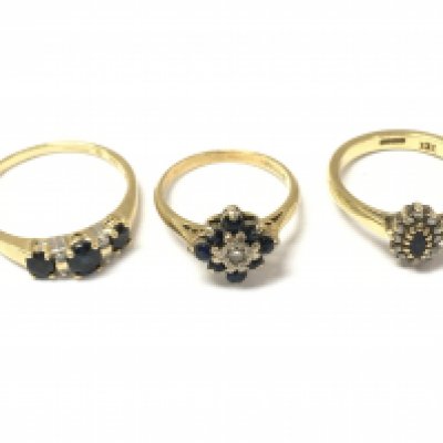 Three 18ct gold sapphire and diamond cluster rings. 8.25g
