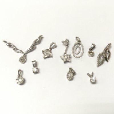 A collection of 9ct white gold diamond pendants. 6.72g