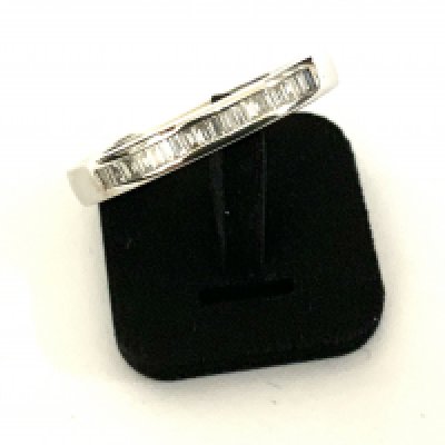 An 18ct white gold and diamond baguette ring, Size N. (A)