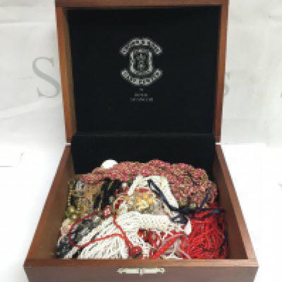 A box of hand made beaded necklaces . Postage category B