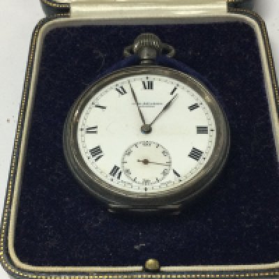 A silver case button wind pocket watch fitted in an original case .