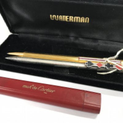 A Cartier pen with case, hallmarked silver Tiffany pen. Postage category A