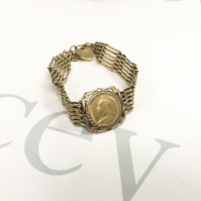 An 1892 shield back full sovereign in a gate bracelet mount. Approx weight 22.26 grams.