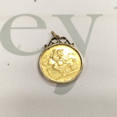 An 1887 double sovereign vvf in a 9ct gold pendant mount.