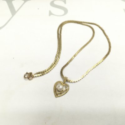 A 9ct gold S link chain with a heart pendant, approx weight 7.83 grams.