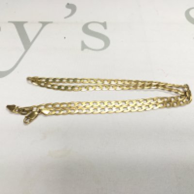 A 9ct gold curb chain. Approx weight 15 grams.