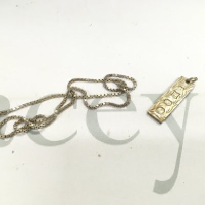 A silver box link chain and a silver ingot. Approx weight 24.76 grams.