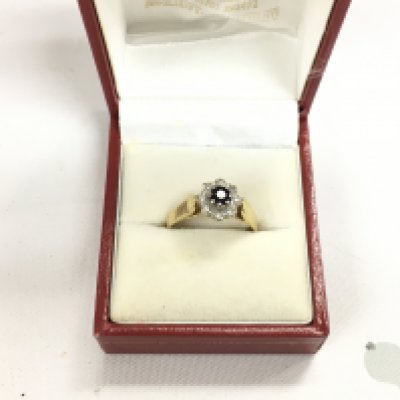 An 18ct fold sapphire and diamond set ring. Approx weight 3.62 grams, size P.