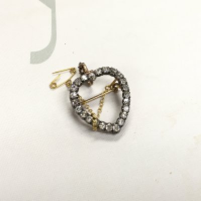 A diamond set open heart brooch.