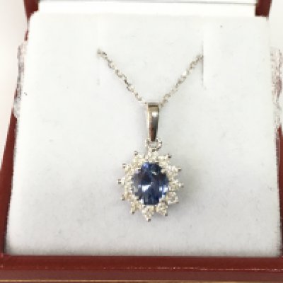 18ct white gold oval sapphire and RBC diamond pendant on an 18ct white gold chain. Sapphire 0.75ct and diamond 0.28ct Postage B