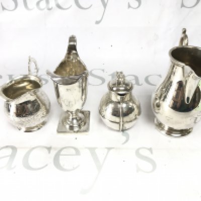 A collection of four silver jugs of assorted styles. Total weight 570g Postage B