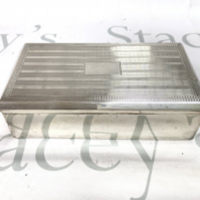 A vintage silver hallmarked cigarette box. 17.5cm wide 9.5cm deep.