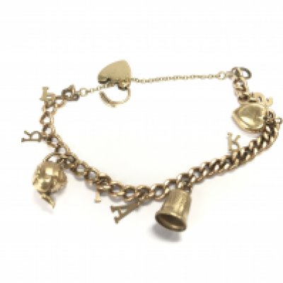 A 9ct gold charm bracelet with assorted charms. 18.58g