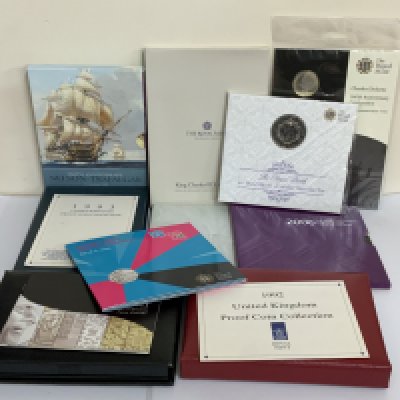 Royal Mint proof and uncirculated coin issue sets. (B)