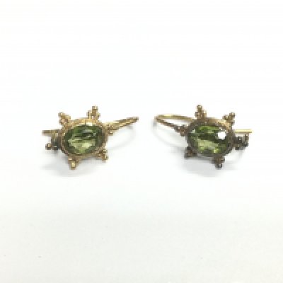 A pair of yellow metal earrings set with peridots, approx 3.9g. Shipping category A. NO RESERVE