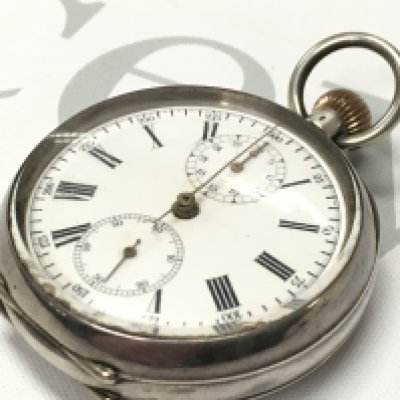 A silver cased pocket stop watch, seen working. Postage category A