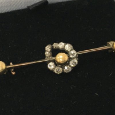 A gold brooch with old cut diamonds , 2.5g total weight. Postage category A