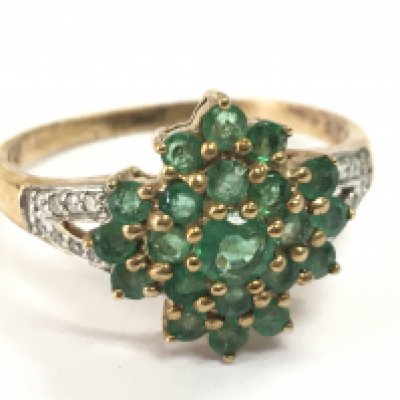 A 9ct gold emerald and diamond shard set ring , 2.5g total weight. Postage category A