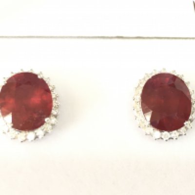 Large 18ct white gold ruby and diamond cluster earrings. Rubies ( glass filled) 8.71ct and diamonds 0.80ct. Postage B