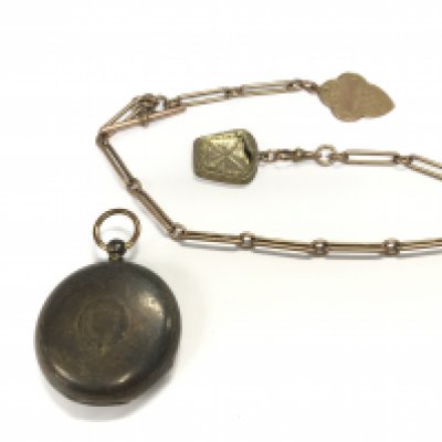 A 9ct gold watch chain with fob 44.26g and approx 37cm in length along with a silver pocket watch. Postage B