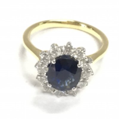 An 18ct yellow and white gold oval sapphire and RBC diamond cluster ring. Sapphire&#2013266057۪s 3.03ct and 0.84ct size N