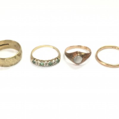 Four 9ct gold rings including two bands and two set with stones. 10.24g Postage A