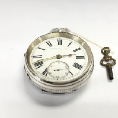 An oversized silver cased pocket watch. Approximately 55mm and 165g