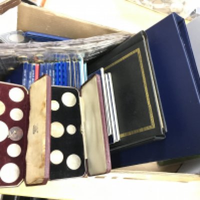 A collection of albums and folders of British coinage and some world notes. Postage C