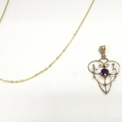 A 9ct gold and amethyst pendant 1.2g and a 14ct rolled gold chain. Postage B