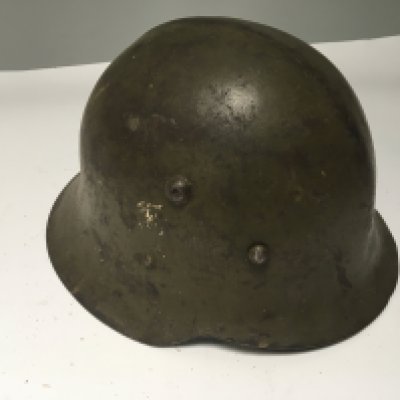An unusual German combat helmet possible I world war M36 pattern made for the Bulgarian Army. All original condition.