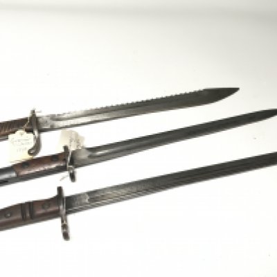 A German Imperial 1890 first pattern pioneers bayonet with saw edge a Remington 1913. and one other German Mauser bayonet no scabbards (3)