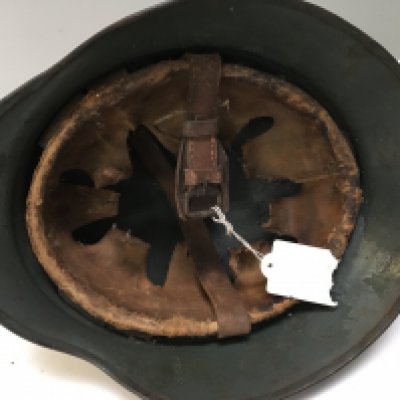 A German I world war combat helmet M-16 pattern and a German type 47 steel helmet with liner folded edge and stamped E1 (2)